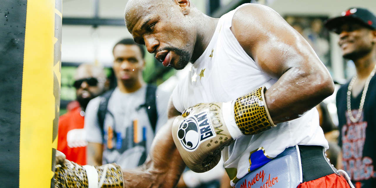 The story behind Floyd Mayweather's opulent fight-night look